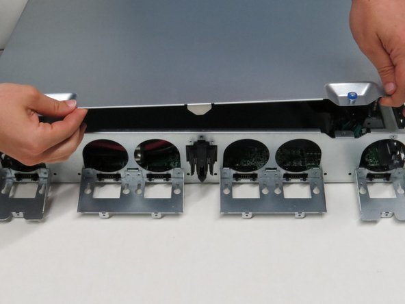 Pull the lid towards the rear of of the chassis.