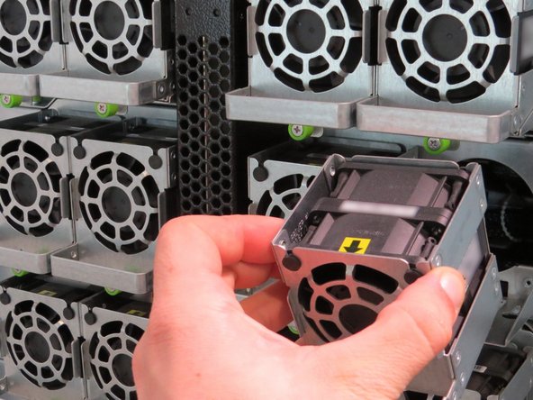 Install a new fan into chassis.