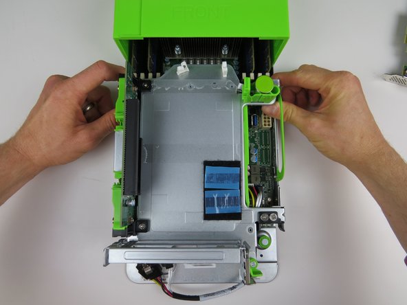 Lock the PCI Riser Cage by pushing the two handles towards the rear of the server until they click into place.