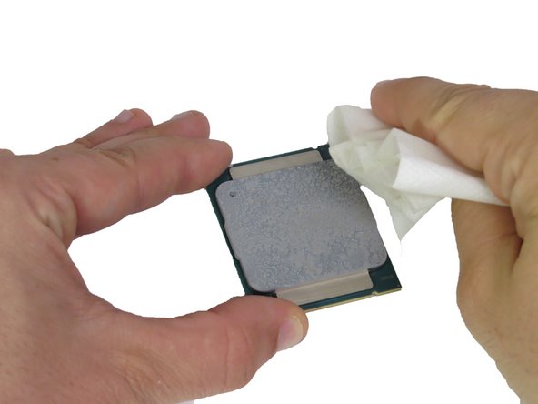 Wipe the top of the CPU with an ispropyl alcohol pad to remove the thermal compound residue.