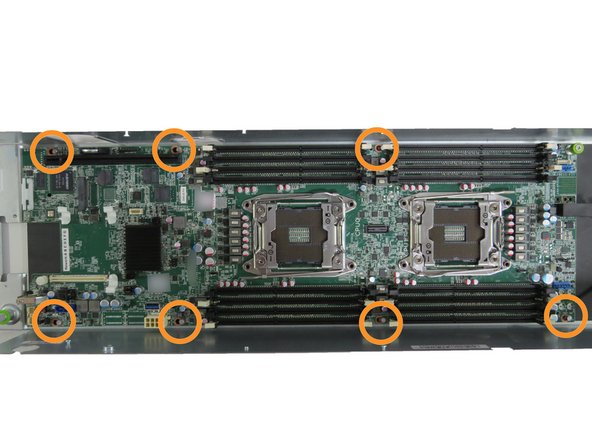 Push the motherboard towards the fans  until (7) motherboard standoffs clear the motherboard guides.