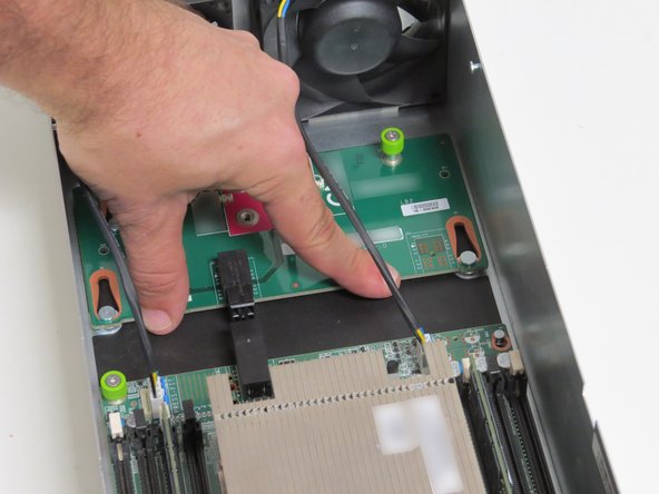 Slide the board to the rear of the server until resistance is felt.