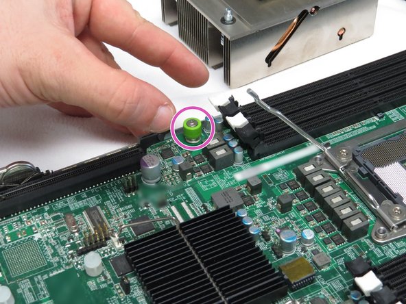 Tighten the thumbscrew shown.