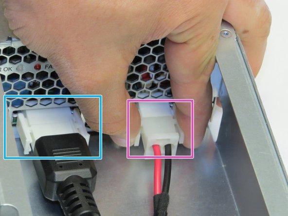 Disconnect one DC cable connector from the PSU.