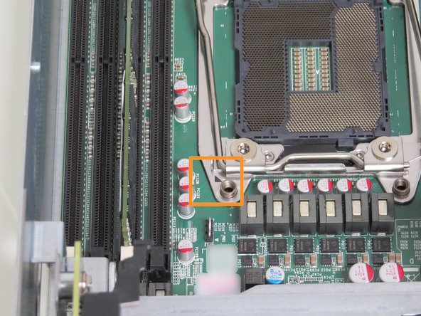 Orientate the CPU so that the arrow printed on the CPU aligns with the arrow printed on the CPU retention housing, as shown.