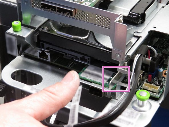 Push the HDD retention tab towards the right of the server node, as shown.
