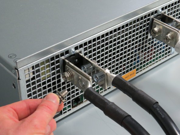 Make sure there is not live power on the bus bars before proceeding with this step.