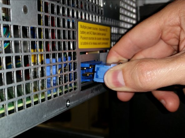 Unplug the blue AC input connector from the back of each shelf (the top power shelf and bottom power shelf).