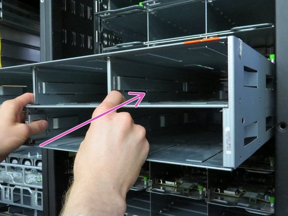 Carefully insert the new power shelf as shown.