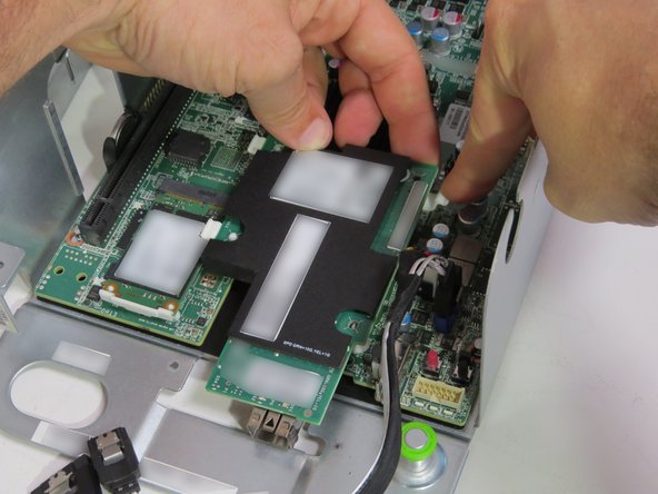 Lift the NIC from the motherboard.