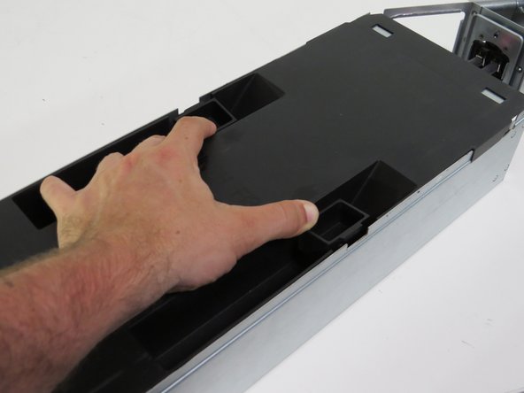 Install the lid on the server, as shown.