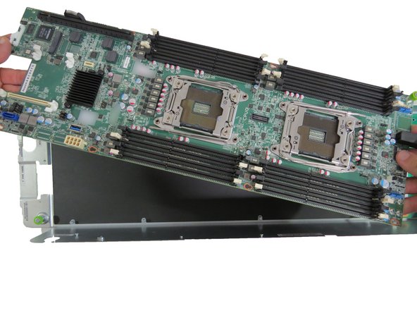 Lift the motherboard from the server chassis.