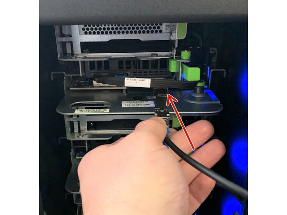 Carefully insert the 10G SFP+ cable into the NIC (Network Interface Controller) port, ensuring it locks into place.