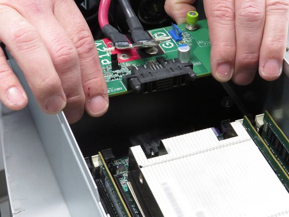 Lift the board away from the server.