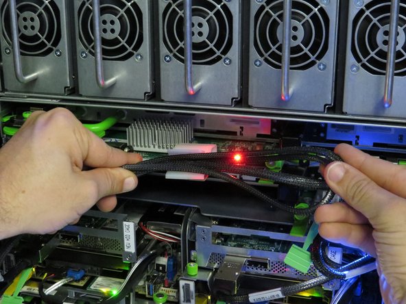 Secure the SAS cable in the nylon cable management clip.