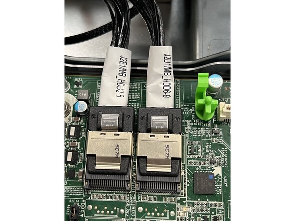 Remove the two disk connectors on the right side of the board.