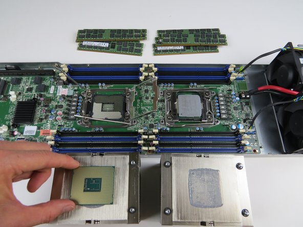 Place the CPUs on top of their respective heatsinks