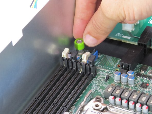 Loosen (1) motherboard thumbscrew.