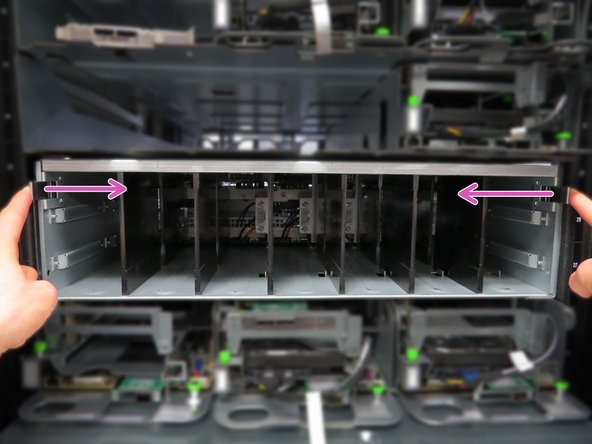 Press the two shelf retention tabs inwards.