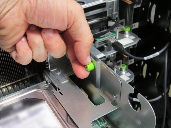 Loosen the (2) thumbscrews, shown.