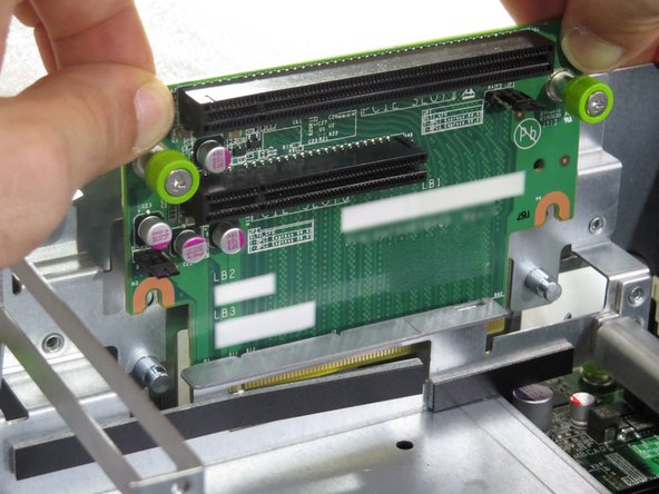 Pull the PCIe card upwards to disconnect it from its socket.