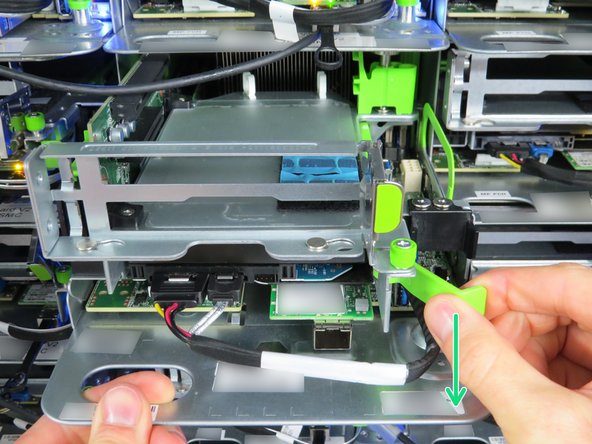 While holding the lever to the right, simultaneously pull it outward to release the HDD from it's socket.
