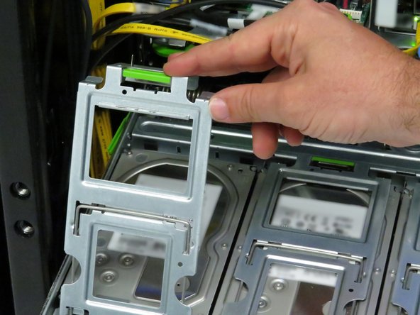 Close and secure the hard disk drive cages.