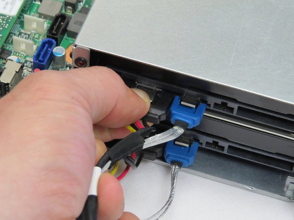 Disconnect the power and SATA connectors from the HDD.