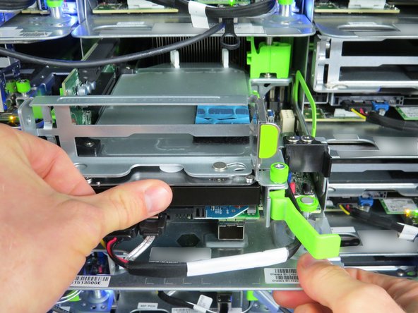 Finish seating the HDD by pushing firmly until resistance is felt.