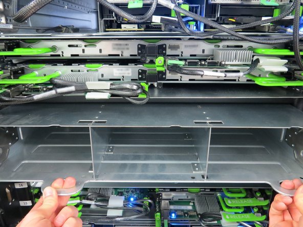 Place a hand underneath the chassis while removing it to counterbalance the weight.