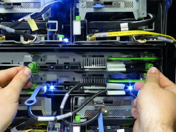 Slide the board into the storage tray.