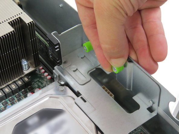 Tighten (2) thumbscrews on the riser card assembly, as shown.