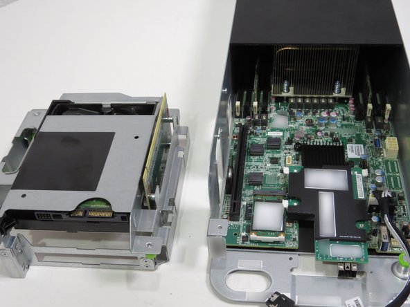 Place the riser card assembly next to the server with the riser card pins facing up, as shown.