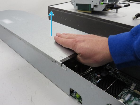 Push the lid towards the rear of the server.