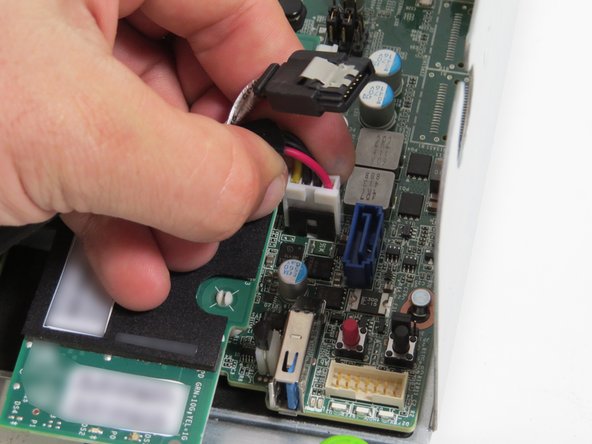 Connect the HDD power and SATA cable connectors to the motherboard.