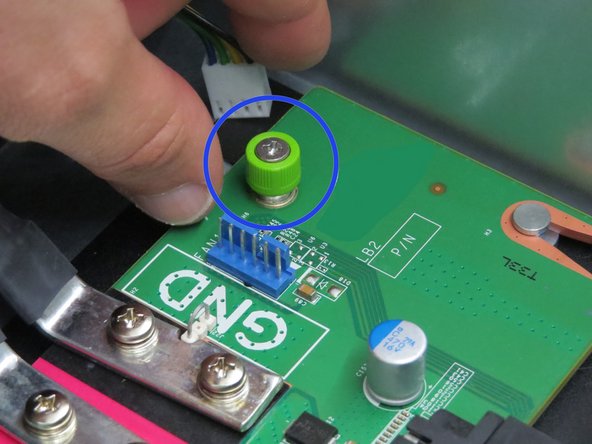 Grab the thumbscrew as shown.