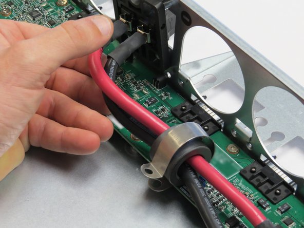 Remove the bus bar clip from the Open Vault chassis.