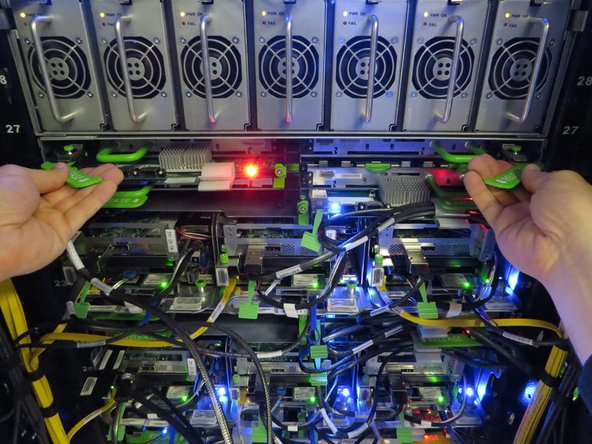 Engage the pull handles, as shown.