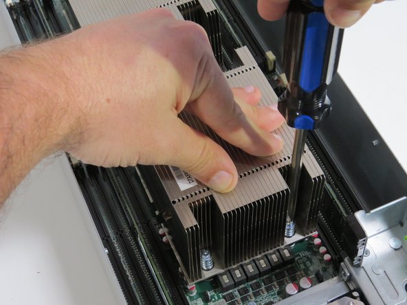 Tighten (4) torque screws using a Phillips #2 screw driver.