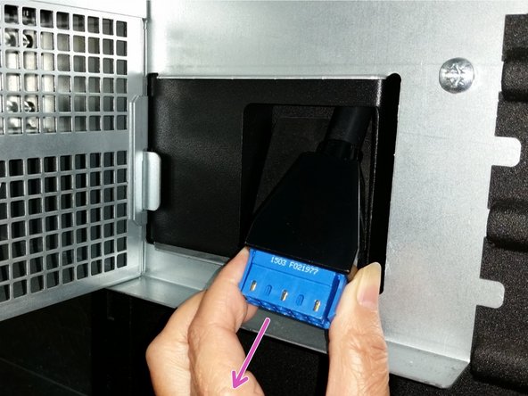 Push the longer (bottom shelf) cable all the way through the trough until the blue AC connector emerges behind the bottom shelf.