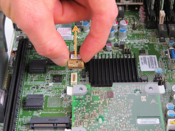 To remove, grip the module on each side, then pull upwards as shown.