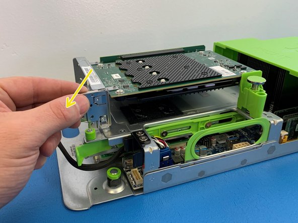 To remove the AVA M.2 carrier card by  unhooking the metal hook tab on the left side of the bracket.