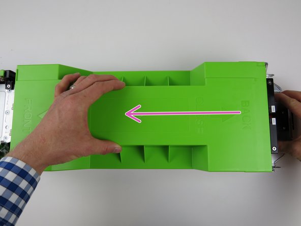 Firmly pull towards the front of the server chassis to release the lid.