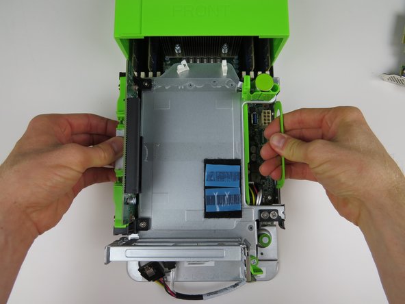 Lift the PCI Riser Cage from the server chassis.