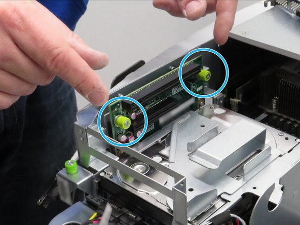 Loosen the (2) thumbscrews securing the PCI riser card.