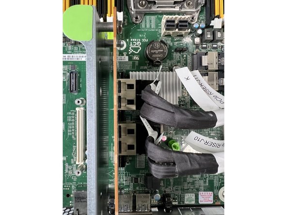 Remove the four riser card connections.