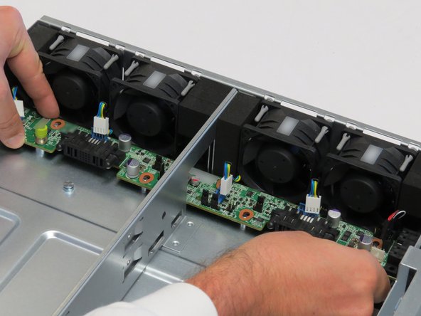 Slide the midplane board towards the front of the chassis.