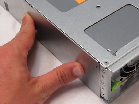 Release the retention plunger to secure the PSU.