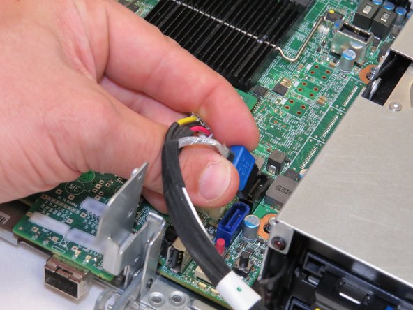 The SATA connector has a metal tab that must be depressed to release the cable.