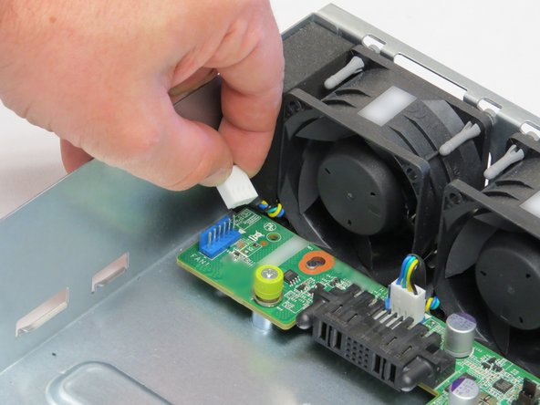 Disconnect the four fan power cables connected to the midplane board.